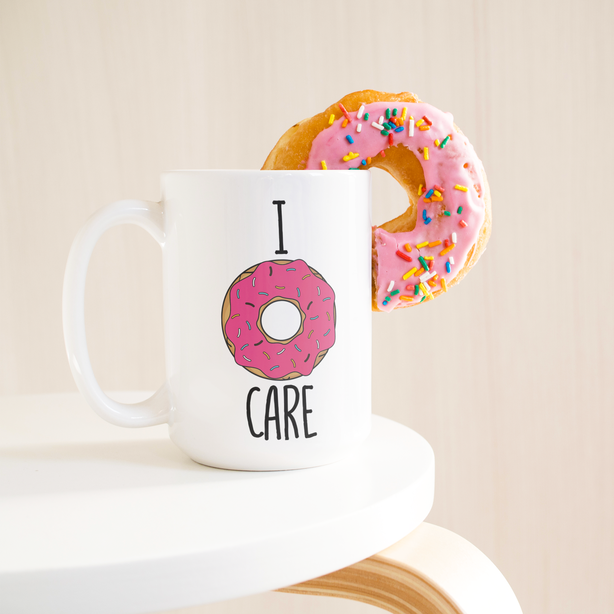 I_donut_care_15ozWhiteMugLifetsyleDonutLH_Mockup.png_15673598