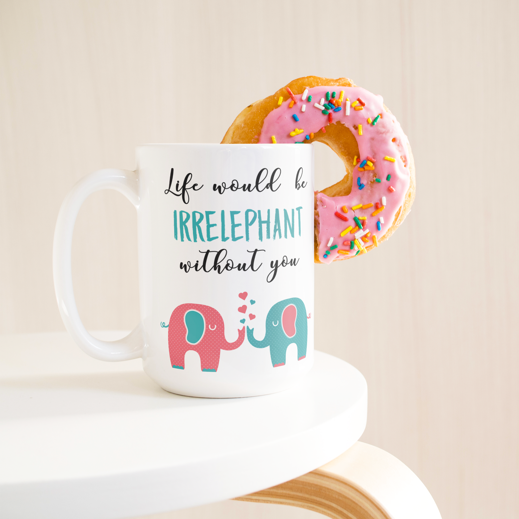 Irrelephant_15ozWhiteMugLifetsyleDonutLH_Mockup.png_15767167