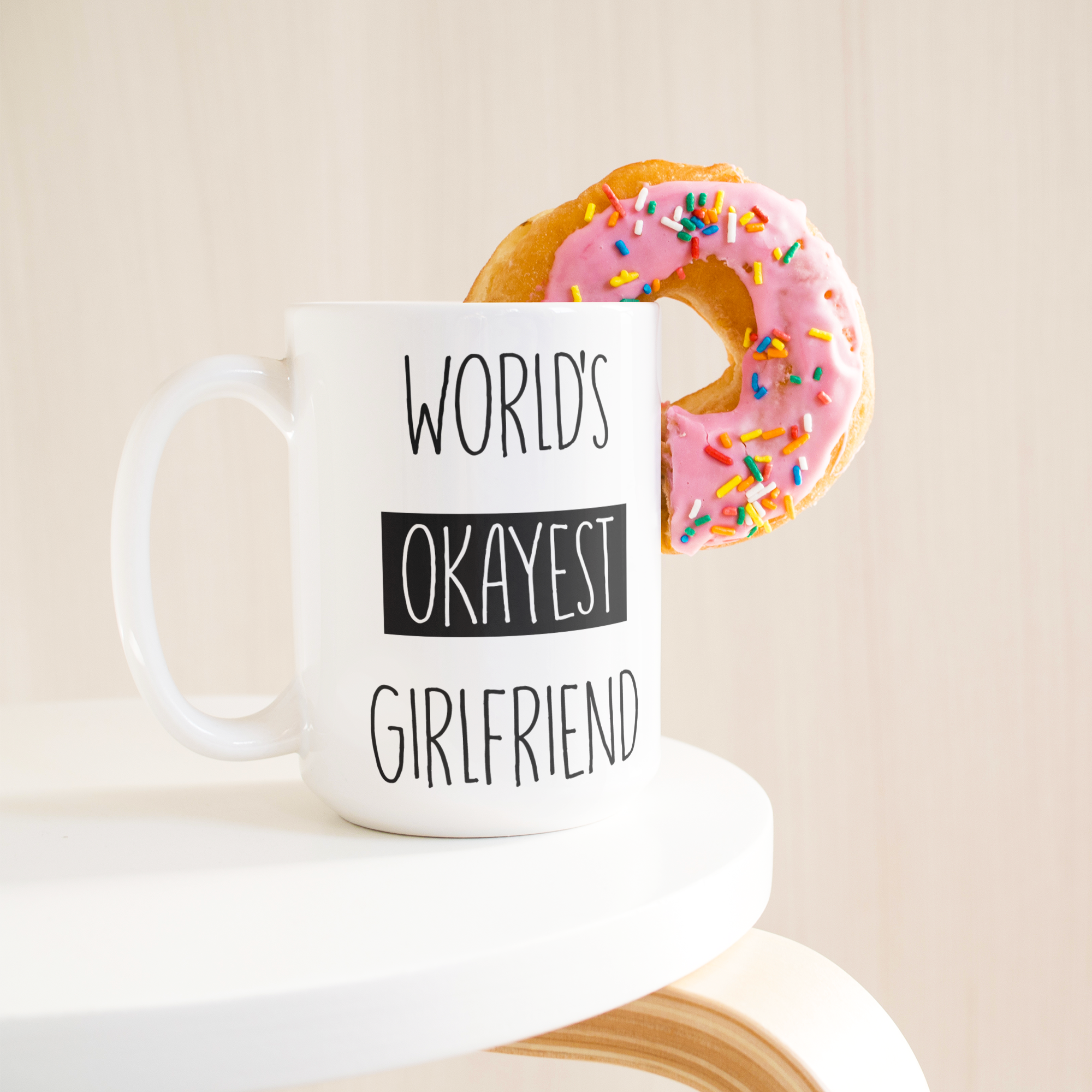 Okayest_Girlfriend_15ozWhiteMugLifetsyleDonutLH_Mockup.png_15664920