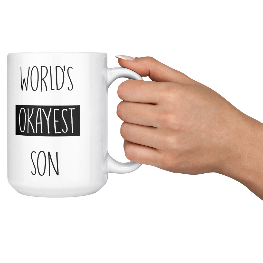 Okayest_son_15ozWhiteMugLifestyleRHCheers_Mockup.png_15683850