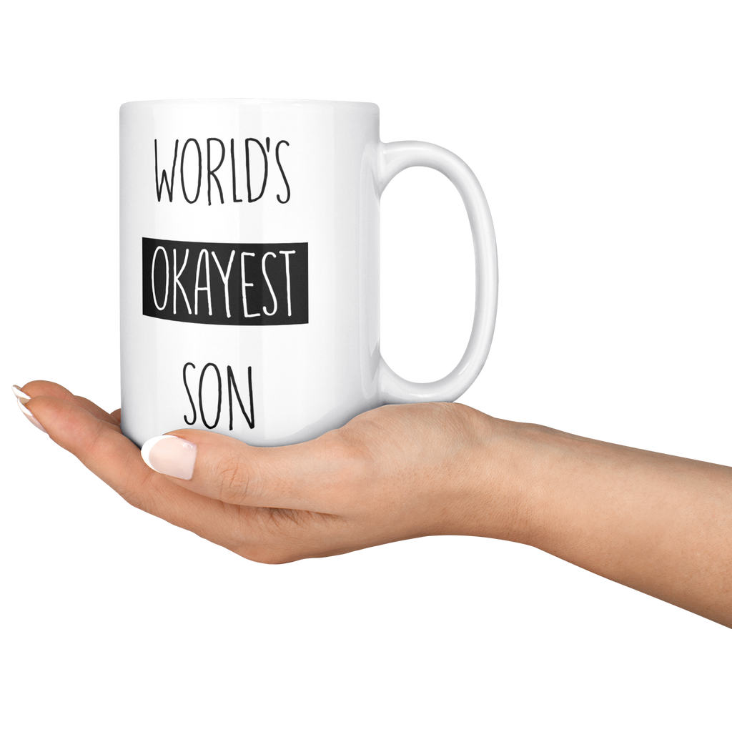 Okayest_son_15ozWhiteMugLifestyleRHServing_Mockup.png_15683851