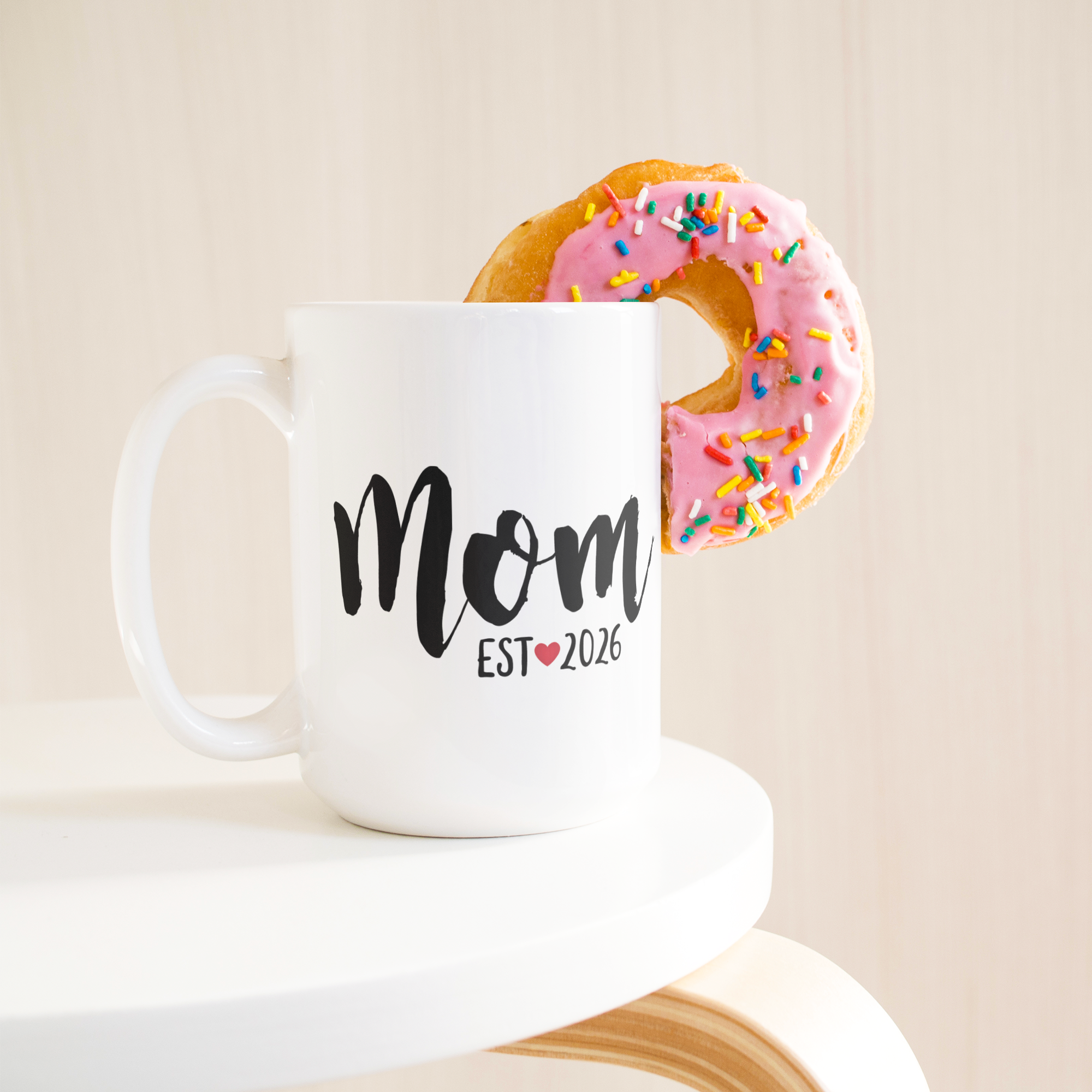 test_mockup_mom_15ozWhiteMugLifetsyleDonutLH_Mockup.png_15584989